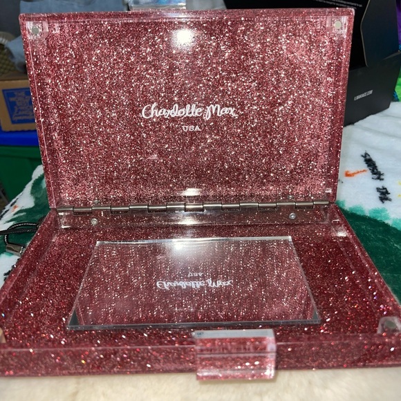 Learn More
Gorgeous Charlotte Max Lucite clutch
Purole pink w glitter detail - Picture 3 of 5